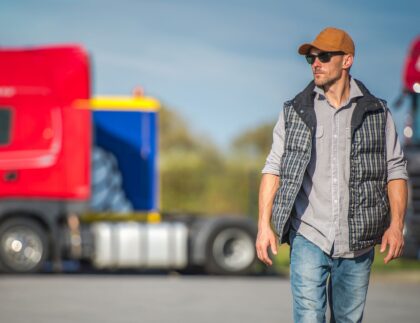 Man walking away from trucks