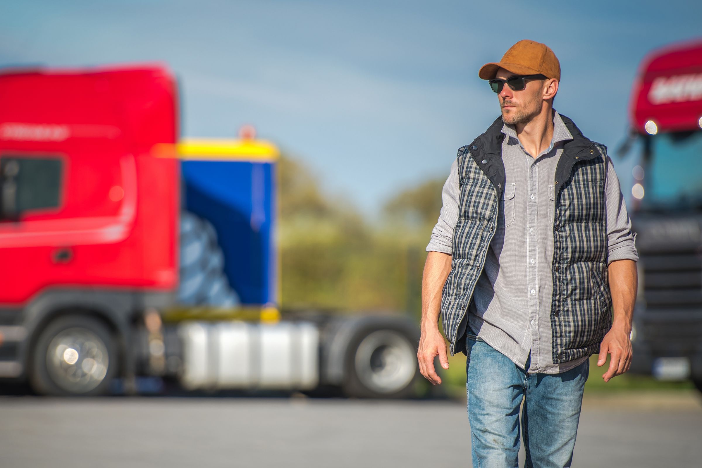 Man walking away from trucks
